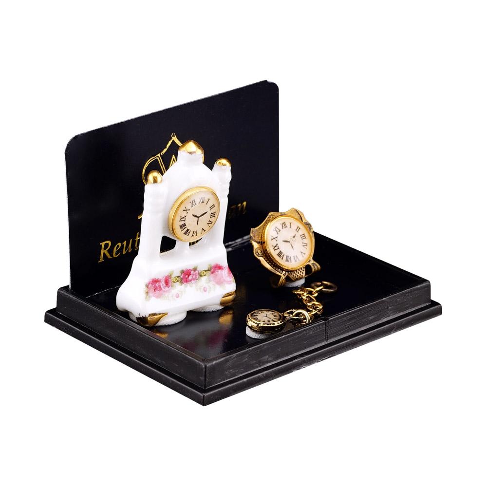 Uhrentrio - Säulenuhr aus Porzellan mit Goldwecker und Taschenuhr aus Metall