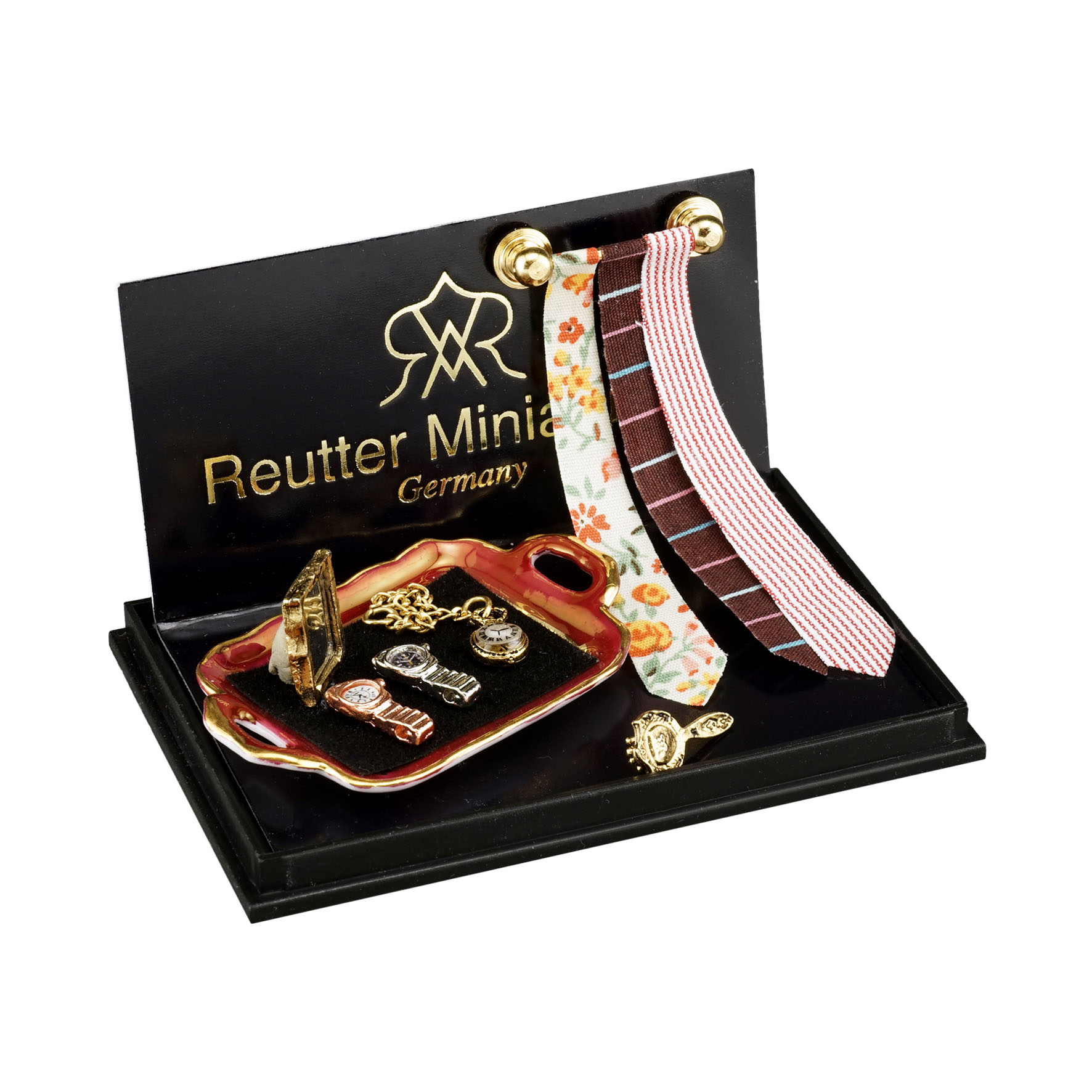 Krawattenhalter mit 3 Krawatten, Taschen- und Armbanduhr sowie Spiegel und Bürste