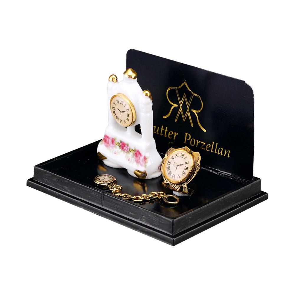 Uhrentrio - Säulenuhr aus Porzellan mit Goldwecker und Taschenuhr aus Metall