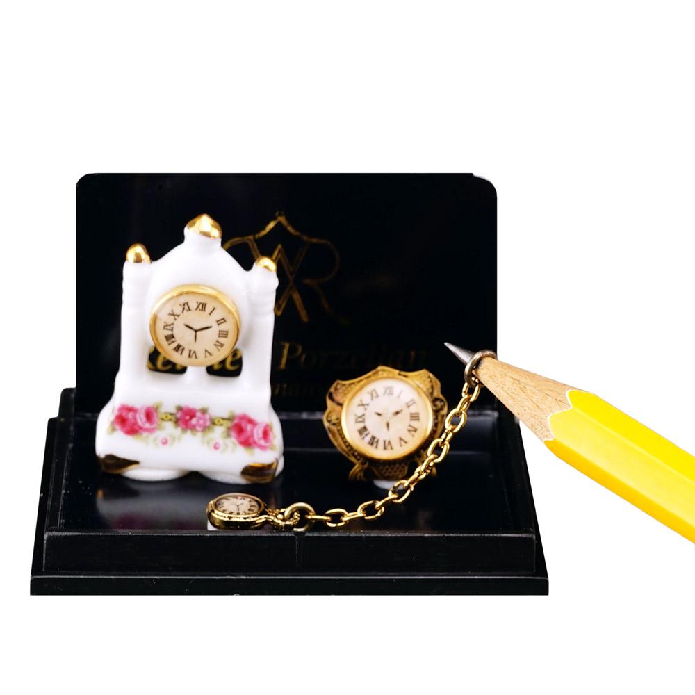 Uhrentrio - Säulenuhr aus Porzellan mit Goldwecker und Taschenuhr aus Metall