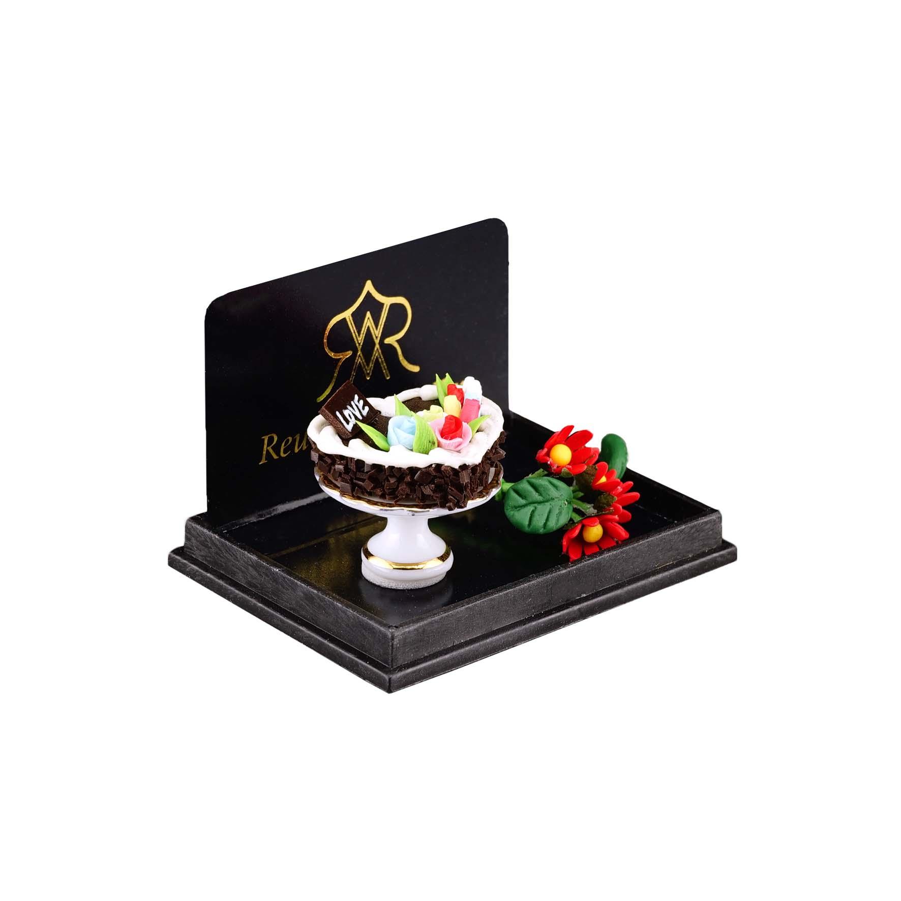 Valentinstag mit Herzkuchen und Blumen