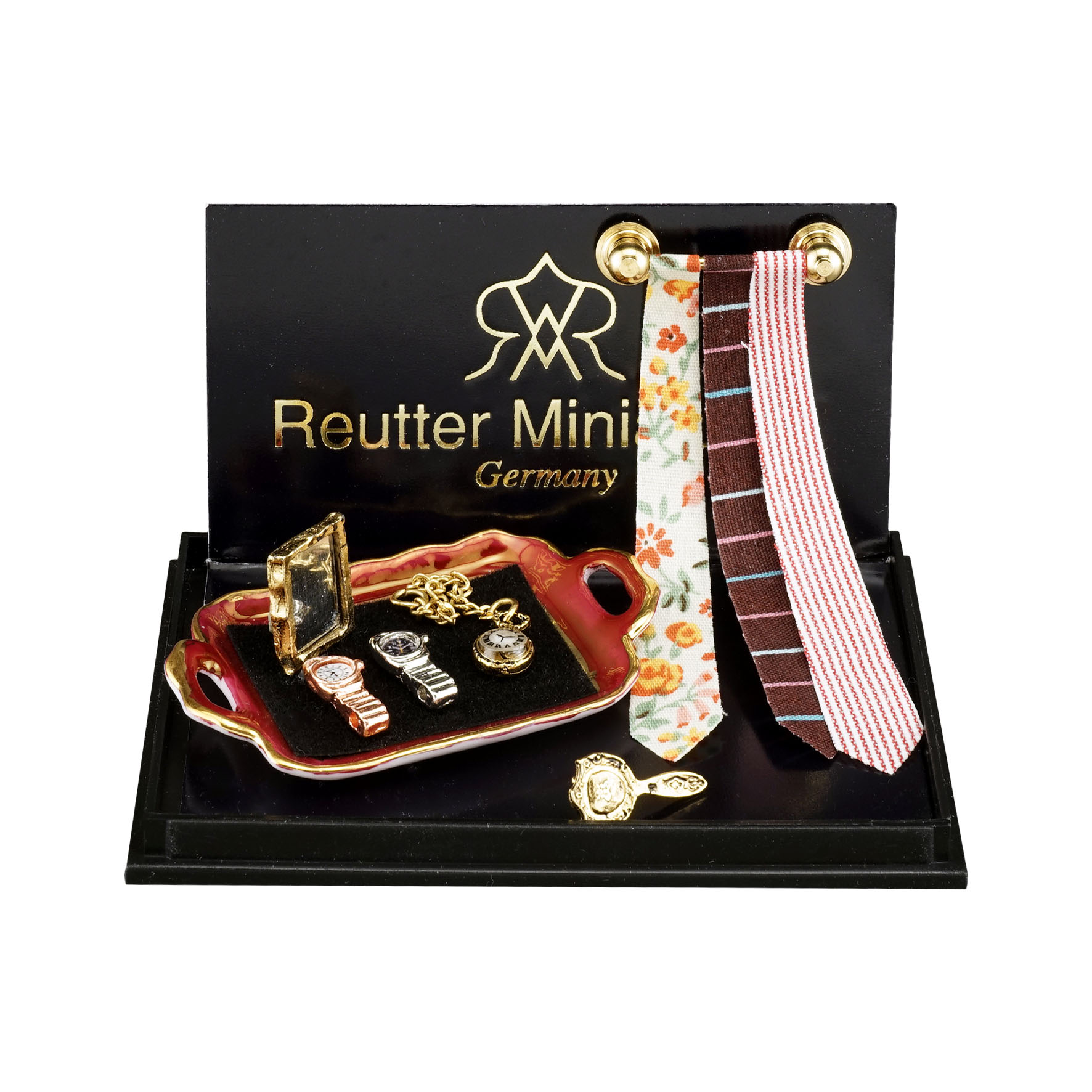 Krawattenhalter mit 3 Krawatten, Taschen- und Armbanduhr sowie Spiegel und Bürste