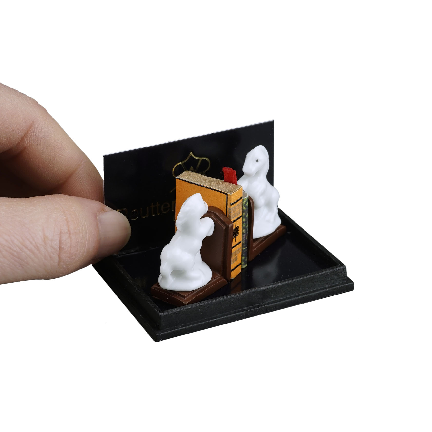 2 Buchstützen mit Pferdefiguren und Bücher