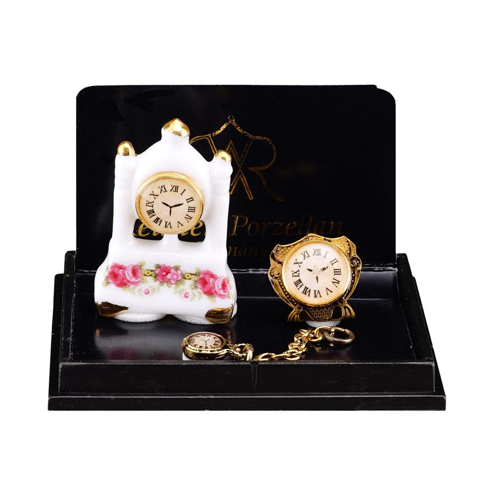 Uhrentrio - Säulenuhr aus Porzellan mit Goldwecker und Taschenuhr aus Metall